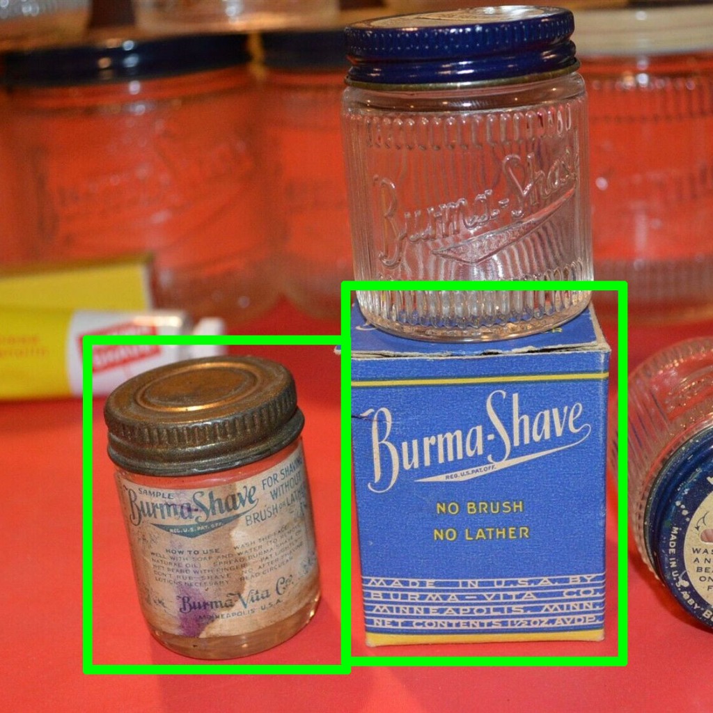 A small paper-label sample jar of Burma-Shave, and a larger ribbed sample jar and cardboard box it was packaged in.